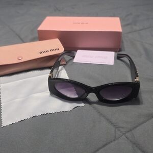 Miu Miu Black Sunglasses with Purple Lenses